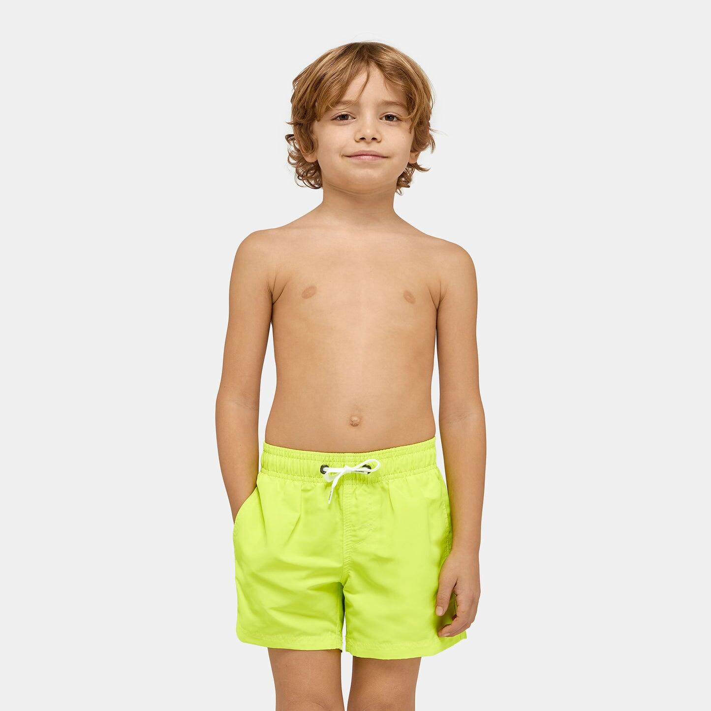 boy wearing Neon Green Swim Shorts for Boys