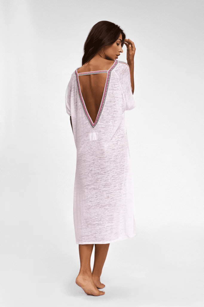Woman showcasing V Back Dress in White